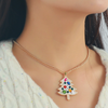 Best believe you'll be&nbsp;bejeweled when you walk into any room this holiday season.&nbsp; Our colorful Bejeweled Holiday Tree Pendant gold chain necklace is a show stopper.