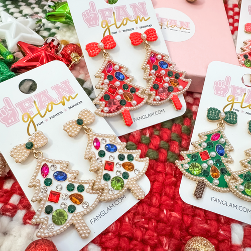 Best believe you'll be&nbsp;bejeweled when you walk into any room this holiday season.&nbsp; Our colorful jeweled Holiday Tree Bow Top Pearl Dangles are the perfect holiday show stopper to compliment any festive holiday fit.