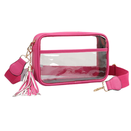 It's Here!!! Our Game Day stadium compliant crossbody zip bag! Featuring a clear PVC body with hot pink trim and gold metal accents. Comfortable and roomy, this bag is perfect for the Game Day girl who likes to come prepared! The main compartment features a zip closure that secures your personal items safely within. There is also a clear side pocket where you can add additional items for quick access. Removable strap makes it easy and fun to sport your favorite team colored bag straps too!