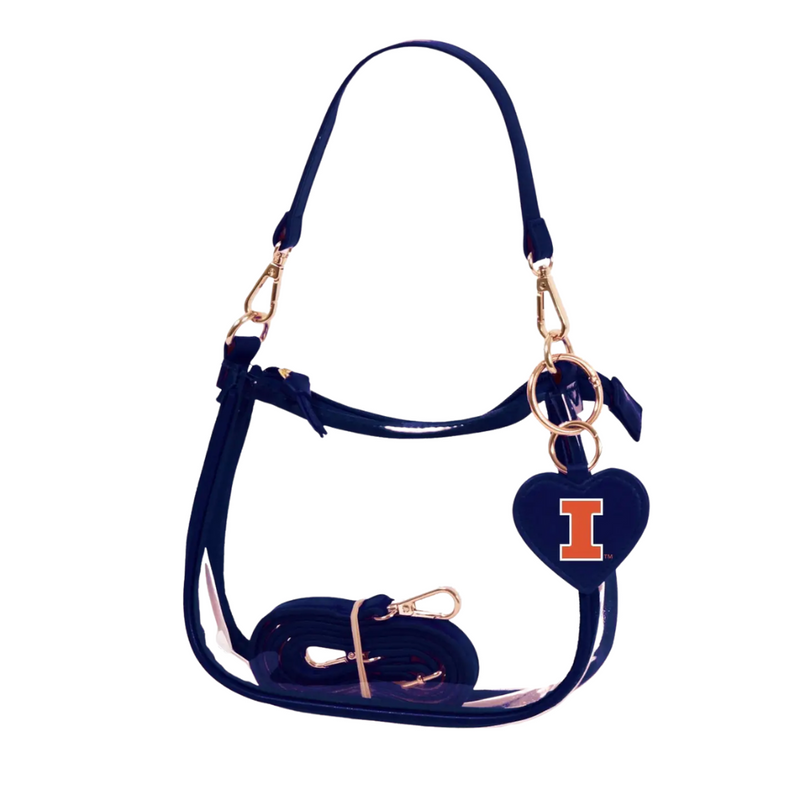 Our new Clara Clear Bag perfectly blends function and fashion, meeting stadium regulations with a chic design. It features a durable PVC body, secure zipper closure, and two interchangeable straps, keeping your essentials stylish and secure on game day.&nbsp;