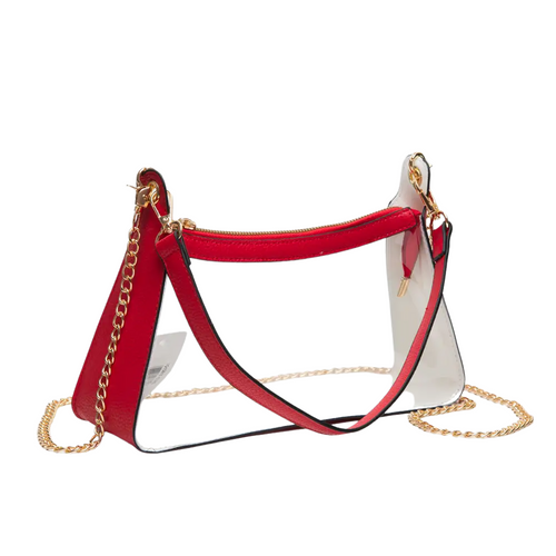 She’s classy, sassy, and stadium-approved.. The Jackie Clear Satchel brings the perfect mix of sleek style and game day glam with her structured silhouette, gold chain strap, and just the right amount of edge. Whether you're headed to the tailgate or the turn-up, Jackie’s got your back (and your lip gloss).