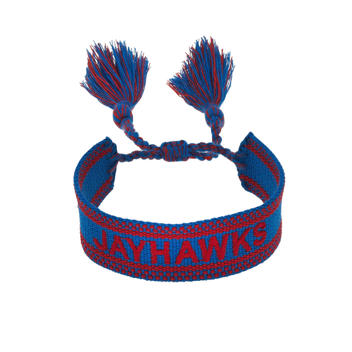 Show your Jayhawks pride with this Kansas Jayhawks Woven Tassel Bracelet! Lightweight and colorful, it adds a playful pop to your game day look while keeping your spirit high. Perfect for stacking or wearing solo, this bracelet makes cheering for your team even more fun.