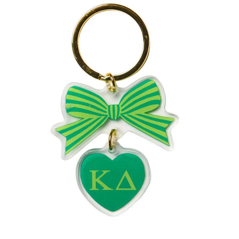 Add a splash of charm to your keys with the Bow-Dacious Key Chain! Featuring a delightful bow design accented with your sorority letters, this playful accessory is perfect for showing off your sisterhood pride in style. Compact and cute, it’s an ideal gift or a fun treat for yourself to keep your keys looking fabulous.