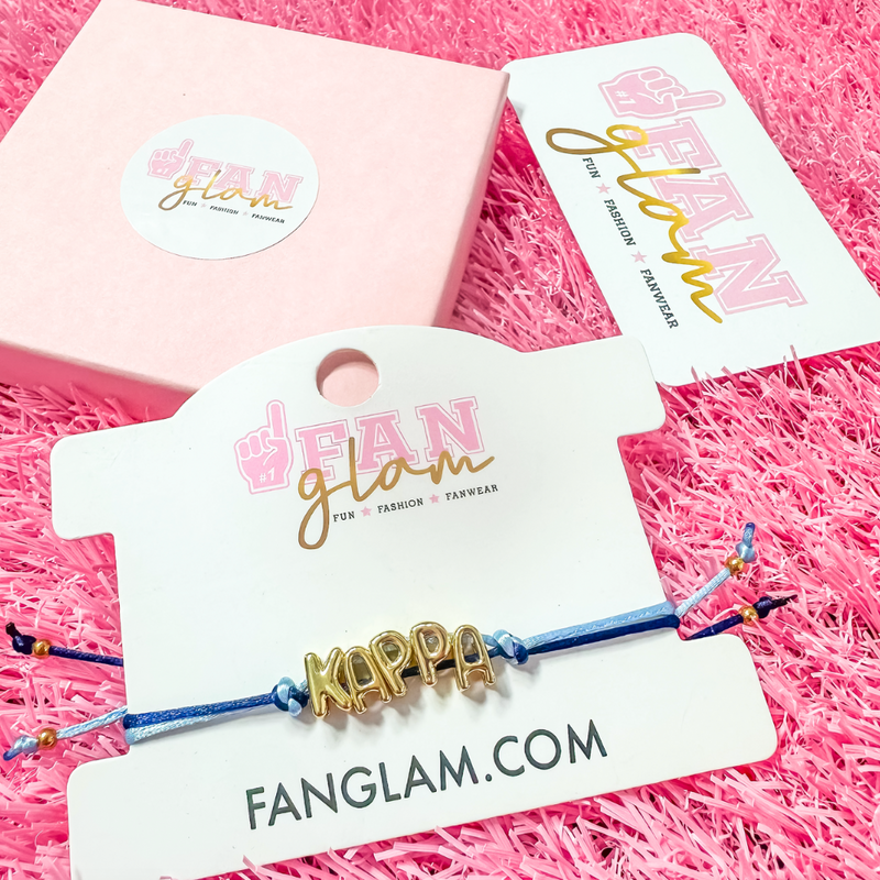 Our new cinch tie bracelets are the perfect pop of Greek glam — stackable, adjustable, and so on trend! Whether you are spoiling your Little, surprising your Big, or celebrating Bid Day, our gold letter greek bracelet adds just the right sparkle to every sorority moment.

With its comfy fit and meaningful charm, it's the go-to gift for your Greek fam — because sisterhood looks good on you!