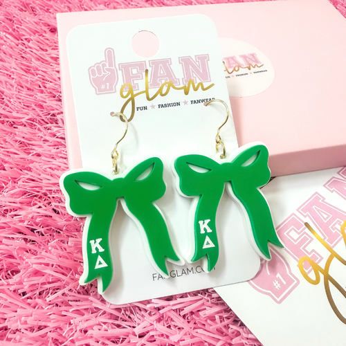 Add the perfect finishing touch to your Bid Day look with our Bid Day Bow Earrings! These bold, lightweight bows are designed to show off your chapter spirit with style and sparkle. Pair them with your favorite Bid Day fit for a look that's full of fun and sisterhood pride!