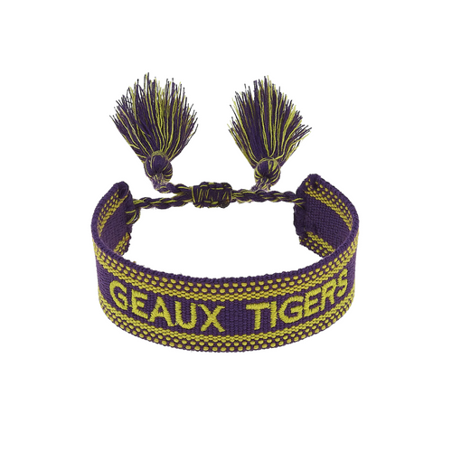 Show your LSU pride with this vibrant Woven Tassel Bracelet! Lightweight and colorful, it’s the perfect game day accessory to cheer on your Tigers while adding a playful pop to your outfit. Wear it solo or stack with your favorite bracelets for extra spirit and style.