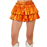 Our Metallic Skort is here to steal the spotlight in orange, purple, or red!&nbsp;With a flirty fit, fierce shine, and built-in shorts for all-day comfort, it's made for dancing, cheering, and being the most extra in the stands. Pair it with your fave tee and let the glam do the talking!