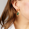 Get your Go Green! Go White! on with these fun and fierce Michigan State Spartans enamel hoop earrings! Rocking the iconic Spartan helmet in bold, glossy green on a gold hoop, they’re the perfect little power move for game days, tailgates, or just flexing your Sparty pride every day. Light, bright, and full of fight — these hoops may be small, but they pack a big Spartan Strong punch.&nbsp;