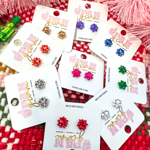 Even the smallest gifts can be packaged with a festive bow on top.&nbsp; Wrap your ears in holiday GLAM this season in our classic mini holiday bow stud earrings, available in 9 festive colors.&nbsp;