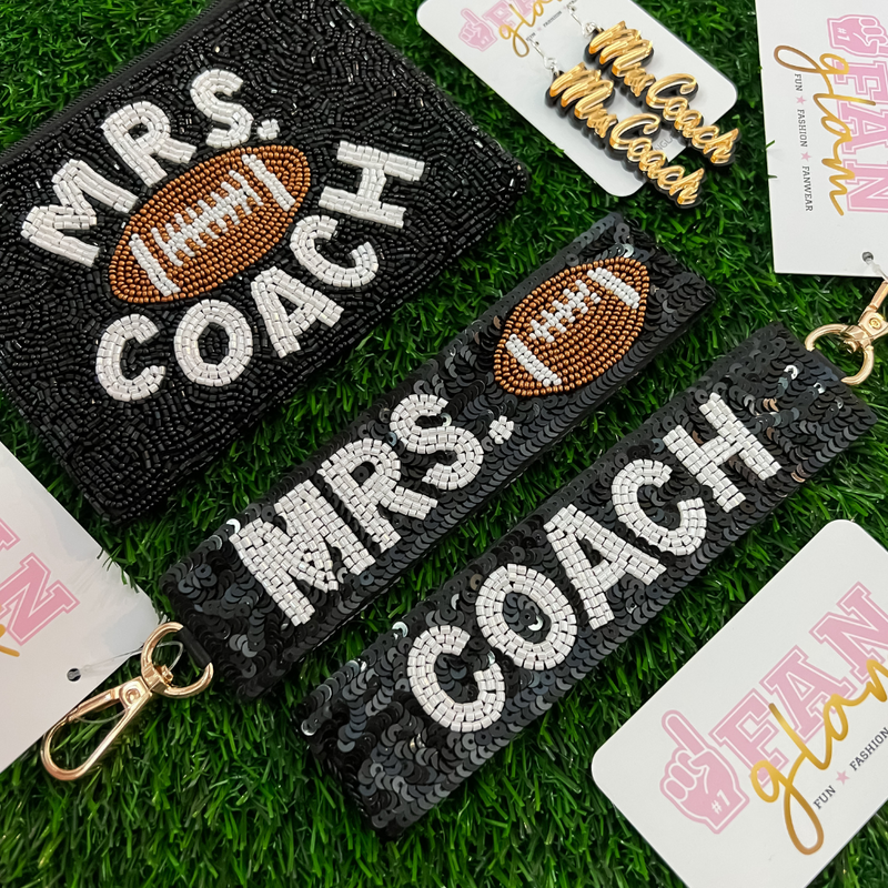 We all know home is where the heart is.  But for some, home is where sports take them.  For all the coach's wives that support their families both on and off the field our Mrs. Coach beaded coin bag + sequin wristlet were designed specially for you! 