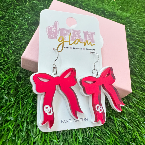 Boomer Sooner... &nbsp;It's Game Day&nbsp;in&nbsp;Norman, and there's no better time to elevate your head-to-toe tailgate style.&nbsp; &nbsp;A perfect accessory for any devoted fan, our exclusive acrylic OU bow dangles offer a unique way to display your allegiance to the Sooners! They're lightweight and easy to wear all day on game days. THE perfect ear candy!