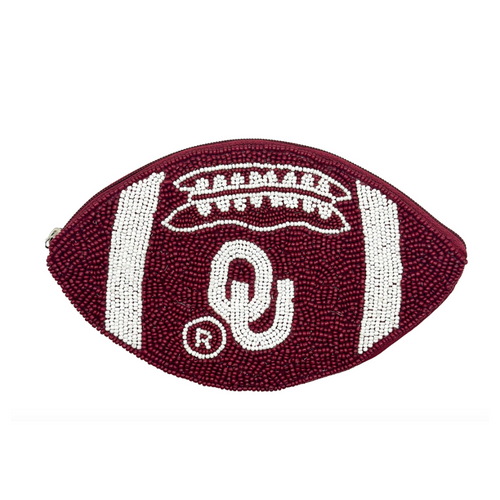 Elevate your clear bag status and show off your SOONERS spirit when accessorizing your Game Day look with our uniquely beaded OU Oklahoma football coin bag.  Featuring a secure zip closure that keeps your cash, credit cards, lipstick, keys + more safe at the game!