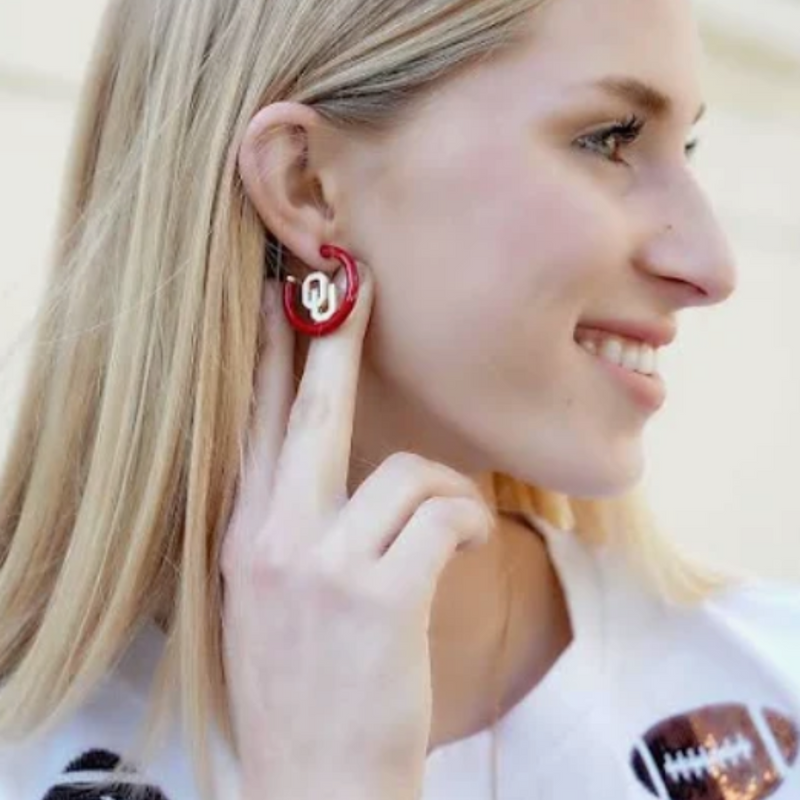 Boomer Sooner... &nbsp;It's GameDay in&nbsp;Norman, and there's no better time to elevate your head-to-toe tailgate style.&nbsp; &nbsp;Accessorize your GameDay fit with our new OU logo Enamel Hoop Earrings!&nbsp;