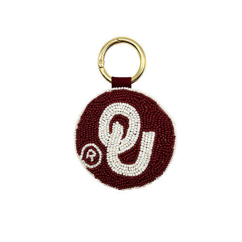 Sooner fans, there's no better time to elevate your clear bag status by accessorizing your Game Day look with our OU Beaded Key Chain / festive bag charm.