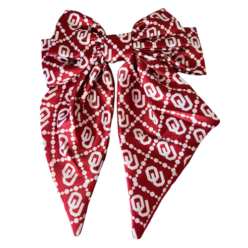 Add a splash of collegiate charm with our Satin Game Day Hair Bow. This playful accessory features a vibrant pattern that’s perfect for showing off your school pride. Whether for game day or everyday fun, this versatile hair bow brings a spirited touch to your collection.
