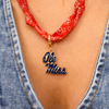 Show your Ole Miss pride with this playful bandana scarf necklace. Perfect for game days or casual outings, it adds a chic, spirited touch to any outfit while keeping you comfortable and stylish. Hotty Toddy, y’all!