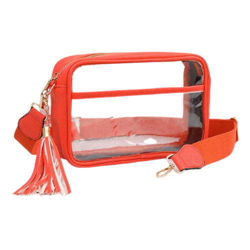 It's Here!!! Our Game Day stadium compliant crossbody zip bag! Featuring a clear PVC body with orange trim and gold metal accents. Comfortable and roomy, this bag is perfect for the Game Day girl who likes to come prepared!