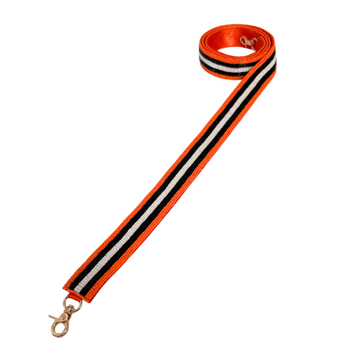 New Fan Glam Exclusive!! &nbsp;

Get ready to elevate your Game Day Glam&nbsp;and cheer your team on in style. Add a pop of spirit to your clear bag with our new Orange, Black, and White beaded bag strap — the perfect blend of fashion and fandom! &nbsp;

Featuring a secure classic gold clasp closure.