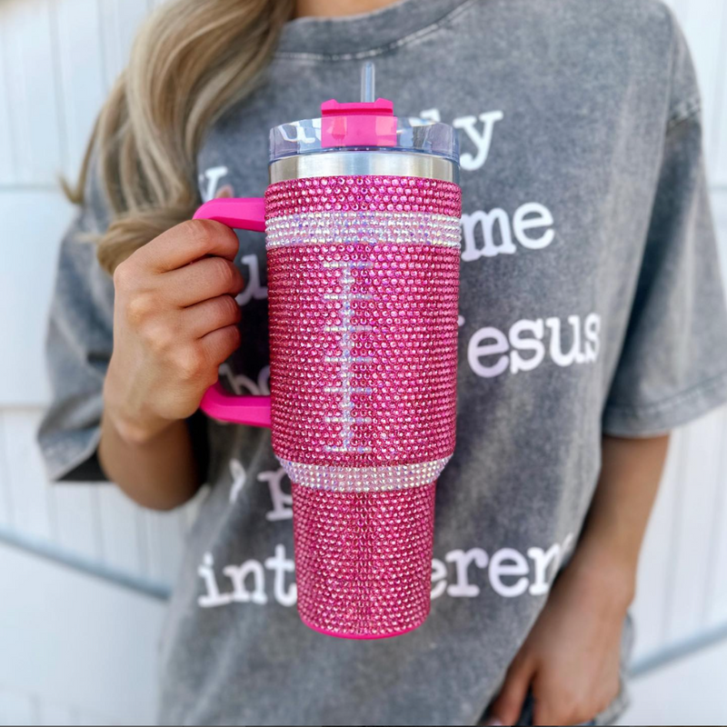 Sip in style on game day + every day!  Add a touch of GAME DAY to any outfit with our PINK CRYSTAL FOOTBALL "Blinged Out" Tumbler!  Indulge in your love for football season and show off your team spirit. These stylish accessories are the perfect addition to your game day fit. 