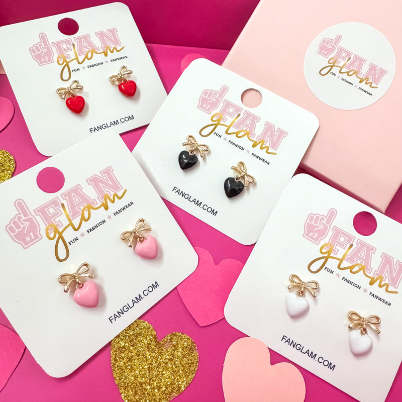 This Valentine's wear your heart on your ears versus your sleeve. &nbsp;Sweet and Chic our new Put A Bow On It Heart Charm Stud Post earrings are soooo cute and adorable.&nbsp; Stack with one of our your favorite huggies OR cute statement studs for the perfect ear candy!&nbsp;