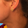 Show your team spirit with these playful Paw Gold Stud Earrings, perfect for game day! These charming studs add a subtle yet stylish touch that highlights your fan pride while keeping your look fun and polished. Lightweight and easy to wear, they’re the perfect accessory to cheer on your favorites in style.