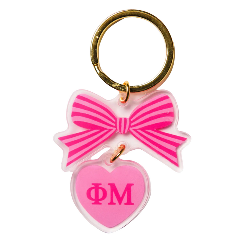 Add a splash of charm to your keys with the Bow-Dacious Key Chain! Featuring a delightful bow design accented with your sorority letters, this playful accessory is perfect for showing off your sisterhood pride in style. Compact and cute, it’s an ideal gift or a fun treat for yourself to keep your keys looking fabulous.