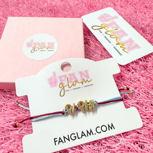 Our new cinch tie bracelets are the perfect pop of Greek glam — stackable, adjustable, and so on trend! Whether you are spoiling your Little, surprising your Big, or celebrating Bid Day, our gold letter greek bracelet adds just the right sparkle to every sorority moment.

With its comfy fit and meaningful charm, it's the go-to gift for your Greek fam — because sisterhood looks good on you!