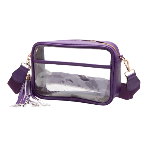 It's Here!!! Our Game Day stadium compliant crossbody zip bag! Featuring a clear PVC body with purple trim and gold metal accents. Comfortable and roomy, this bag is perfect for the Game Day girl who likes to come prepared!