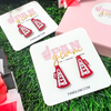 When in doubt, cheer it out. Our GameDay Glitter Glam Cheer Megaphone stud earrings are the perfect pop of color + glam for game time! Super lightweight and comfortable, you will forget you have them on.