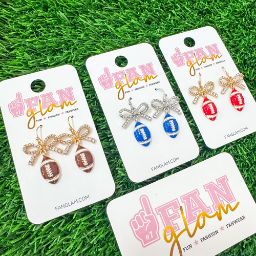 Cute as a BOW!&nbsp; Our new enamel football rhinestone bow dangles our a NEW GameDay favorite!&nbsp; Lightweight and fashion right for Friday Night Lights!