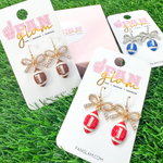 Cute as a BOW!&nbsp; Our new enamel football rhinestone bow dangles our a NEW GameDay favorite!&nbsp; Lightweight and fashion right for Friday Night Lights!