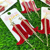 Step up your game day glam with these Red Rhinestone boot earrings! Designed for true fans, these sparkling red glitter cowboy boots feature cascading rhinestone fringe and a gold star stud for the perfect mix of Western charm and game-time sparkle. Whether you're cheering from the stands or hitting a tailgate, these statement earrings will have you shining like a star!