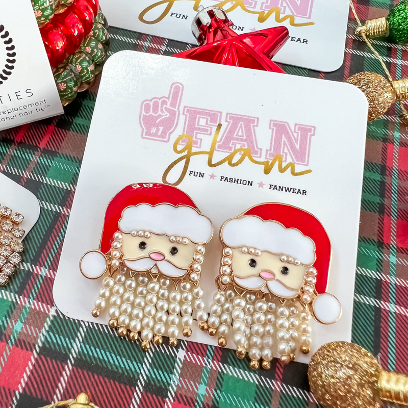 Ho Ho Ho!  Santa Is Coming To Town In GLAM Style!  Tis the season to sparkle in our oh so adorable Santa be-jeweled stud earrings.    A great secret Santa gift or the best GLAM for holiday parties.  Don't miss out on the best ear candy in town.