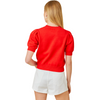 Our red Game Day Puff Sleeve Sweater Top is a total win for your game day lineup. Featuring bold embroidered "Game Day" lettering and a front-and-center football graphic, this vibrant knit brings the hype. Puff sleeves add a playful, girly edge, while the standout red color makes sure all eyes are on you—from the lot to the stands.