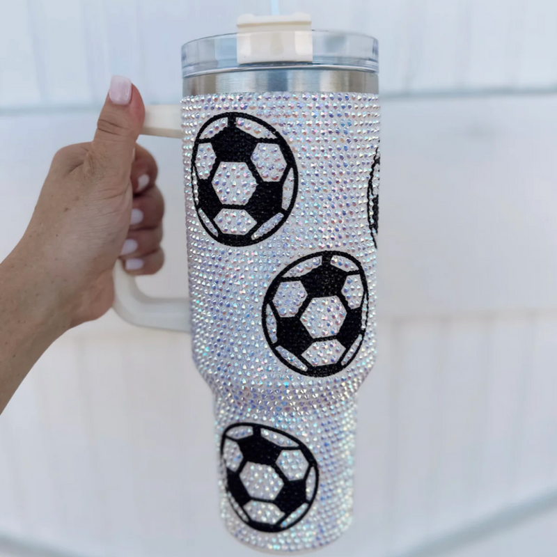 Add a touch of GAME DAY to any outfit with our Crystal SOCCER "Blinged Out" 40 Oz. Tumbler! Indulge in your love for soccer season and show off your team spirit. These stylish accessories are the perfect addition to your collection, making it easy to flaunt your love for the big game.