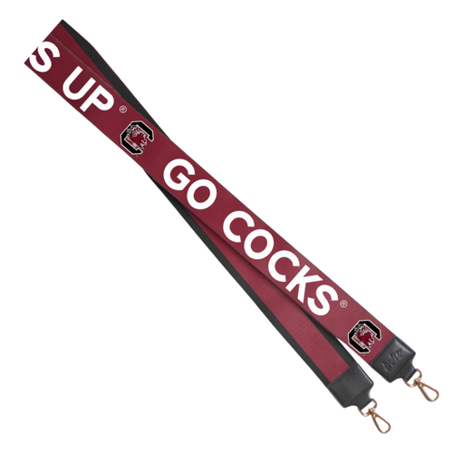 There's no better time to elevate your clear bag status by accessorizing your Game Day clear bag look with our dual sided strap in SC colors! Choose your look with either the striped side or cheer on your team with SPURS UP/GO COCKS!