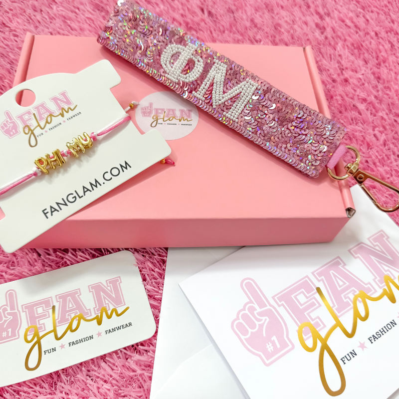 Welcome to sisterhood in style! Our Sorority Starter Glam Box is the perfect way to celebrate Bid Day or even Big/Little reveals!

Inside each Glam Box you’ll find a Sequin Greek Letter Wristlet/Keychain and a Gold Balloon Cinch Tie Bracelet &nbsp;accompanied with a personalized note where you can leave a custom message for your favorite sorority girl!

Whether you're new to Greek life or gifting your Little, this box is packed with spirit, sparkle, and sisterhood.&nbsp;
