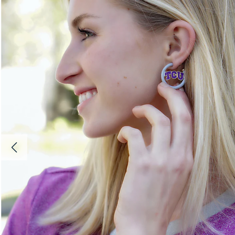 “Riff, Ram, Bah, Zoo... Give 'em Hell, TCU!” &nbsp;It's time to cheer on your frogs and elevate your tailgate glam by accessorizing your Game Day look with our TCU Enamel Hoop Earrings!