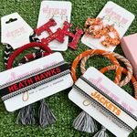 Your team. Your squad. Your identity.  Our Heath Hawks Game  Day Team Tassels have arrived!   The perfect arm candy addition to take you from tailgate to postgame and everywhere in between!  