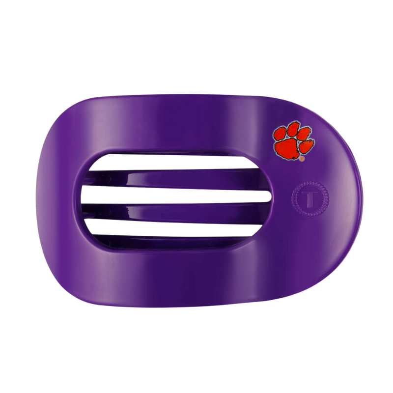 Unwind and relax with the new TELETIES Flat Round Hair Clip! Designed with the same innovative material that is nearly unbreakable, this clip is perfect for lying down, doing yoga or simply laying back without discomfort.&nbsp;Hold your hair and enhance your style with the new Clemson University TELETIES Clip! Go Tigers!&nbsp; 