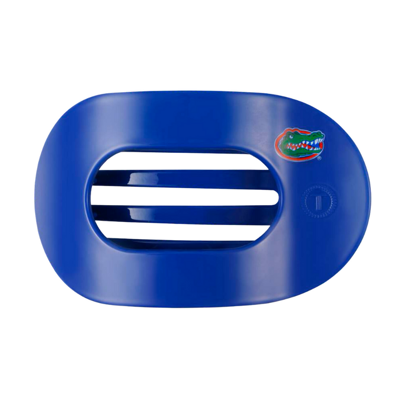 Unwind and relax with the new TELETIES Flat Round Hair Clip! Designed with the same innovative material that is nearly unbreakable, this clip is perfect for lying down, doing yoga or simply laying back without discomfort.&nbsp;Hold your hair and enhance your style with the new University of Florida TELETIES Clip! Go Gators!&nbsp;