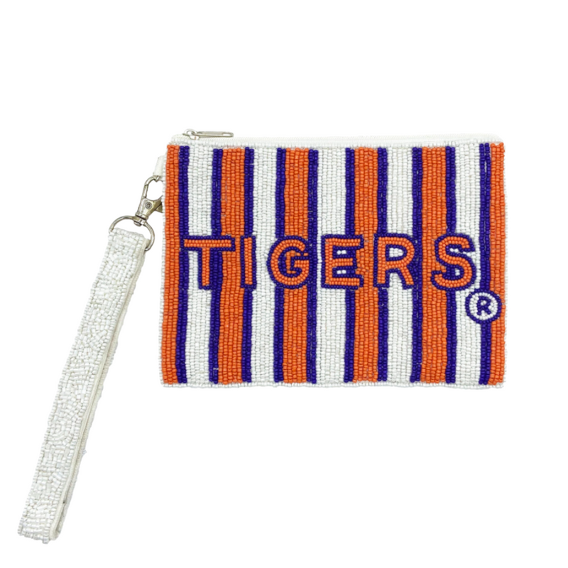 FIGHT Tigers! FIGHT Tigers! FIGHT FIGHT FIGHT!  It's time to cheer on your Tigers and elevate your tailgate glam by accessorizing your Game Day look with our uniquely beaded Tigers wristlet!  Stadium sized approved!!  Wristlet features a secure zip closure that keeps your cash, credit cards, lipstick, keys + more safe at the game!