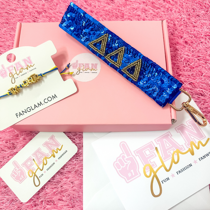 Welcome to sisterhood in style! Our Sorority Starter Glam Box is the perfect way to celebrate Bid Day or even Big/Little reveals!

Inside each Glam Box you’ll find a Sequin Greek Letter Wristlet/Keychain and a Gold Balloon Cinch Tie Bracelet &nbsp;accompanied with a personalized note where you can leave a custom message for your favorite sorority girl!

Whether you're new to Greek life or gifting your Little, this box is packed with spirit, sparkle, and sisterhood.&nbsp;