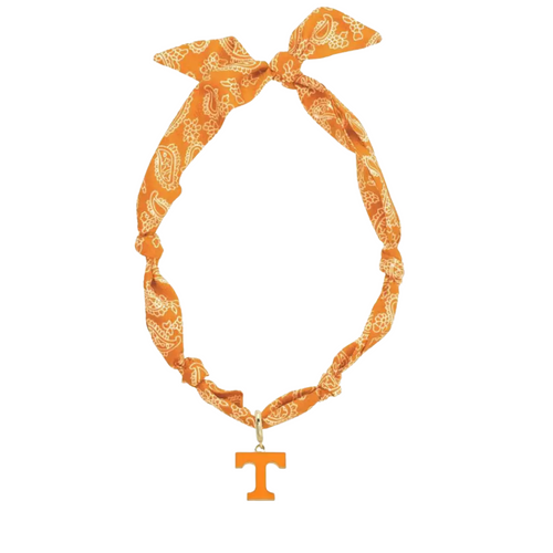 Show off your team spirit with this playful Missouri Tigers Logo Bandana Scarf Necklace. Combining the charm of a bandana with the convenience of a necklace, it’s perfect for adding a fun, sporty touch to any outfit. Lightweight and easy to wear, it’s a great way to cheer on the Tigers in style wherever you go.