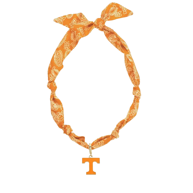 Show off your team spirit with this playful Missouri Tigers Logo Bandana Scarf Necklace. Combining the charm of a bandana with the convenience of a necklace, it’s perfect for adding a fun, sporty touch to any outfit. Lightweight and easy to wear, it’s a great way to cheer on the Tigers in style wherever you go.