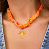 Show off your team spirit with this playful Tennessee Volunteers Logo Bandana Scarf Necklace. It combines the casual charm of a bandana with the fun flair of a necklace, making it a perfect accessory for game days or everyday wear. Lightweight and easy to style, it adds a splash of orange and white to your outfit while keeping your fandom front and center.