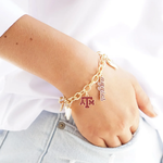 Show your Aggie pride with the Texas A&amp;M Aggies Enamel Icons Charm Bracelet. This gold-plated bracelet sparkles with colorful enamel charms featuring the iconic logo and spirited team symbols. Perfect for stacking on game day or adding a playful touch to your everyday look, it’s a fun way to celebrate your favorite team all season long.
