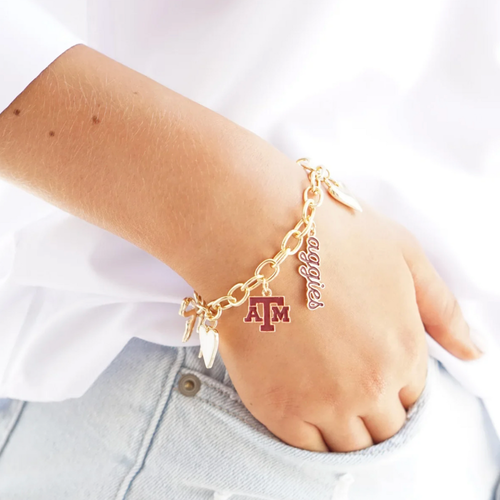Show your Aggie pride with the Texas A&amp;M Aggies Enamel Icons Charm Bracelet. This gold-plated bracelet sparkles with colorful enamel charms featuring the iconic logo and spirited team symbols. Perfect for stacking on game day or adding a playful touch to your everyday look, it’s a fun way to celebrate your favorite team all season long.