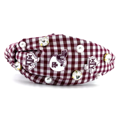 Show your Aggie pride with this playful gingham headband featuring pearls, crystals, and Texas A&amp;M logos along the sides. &nbsp;Comfortable and stylish, it’s perfect for game day or everyday wear.