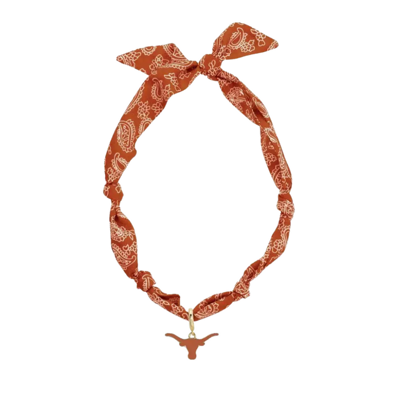 Show your Longhorn pride with this playful bandana scarf necklace, perfect for game day or any day you want to add a touch of Texas flair. Its unique design combines sporty spirit with a preppy twist, making it a fun and stylish accessory for fans ready to cheer on their team in style. Get ready to hook ‘em with flair!